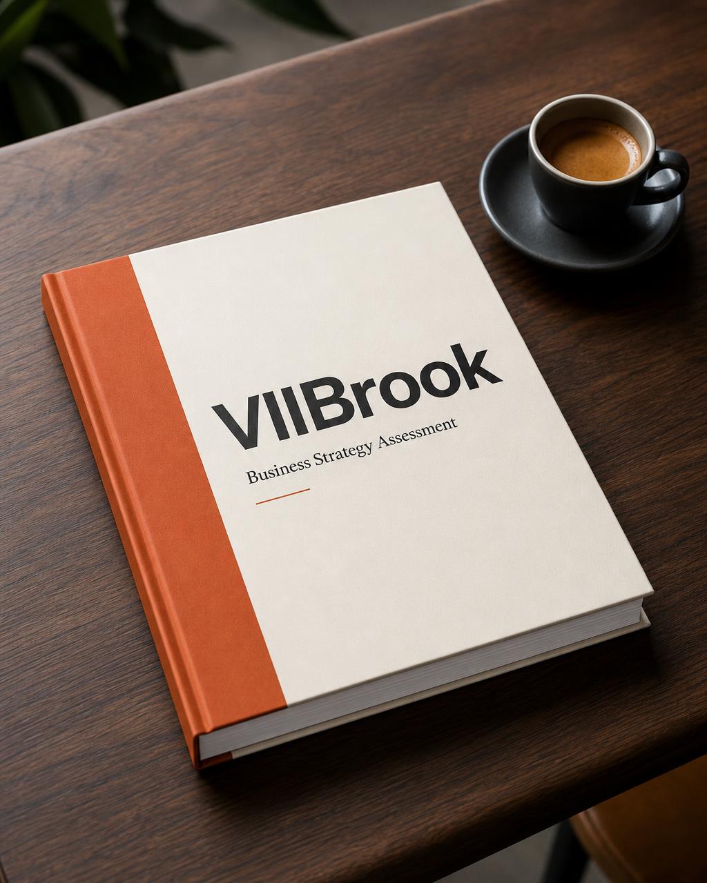 VIIBrook Business Strategy Assessment report mockup on a wooden desk with espresso